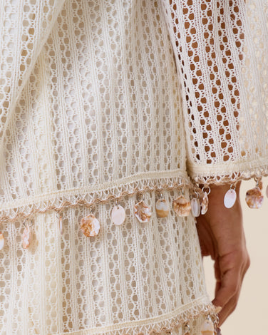 Embellished open knit mini dress