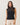 Semi-sheer sleeveless mockneck sweater